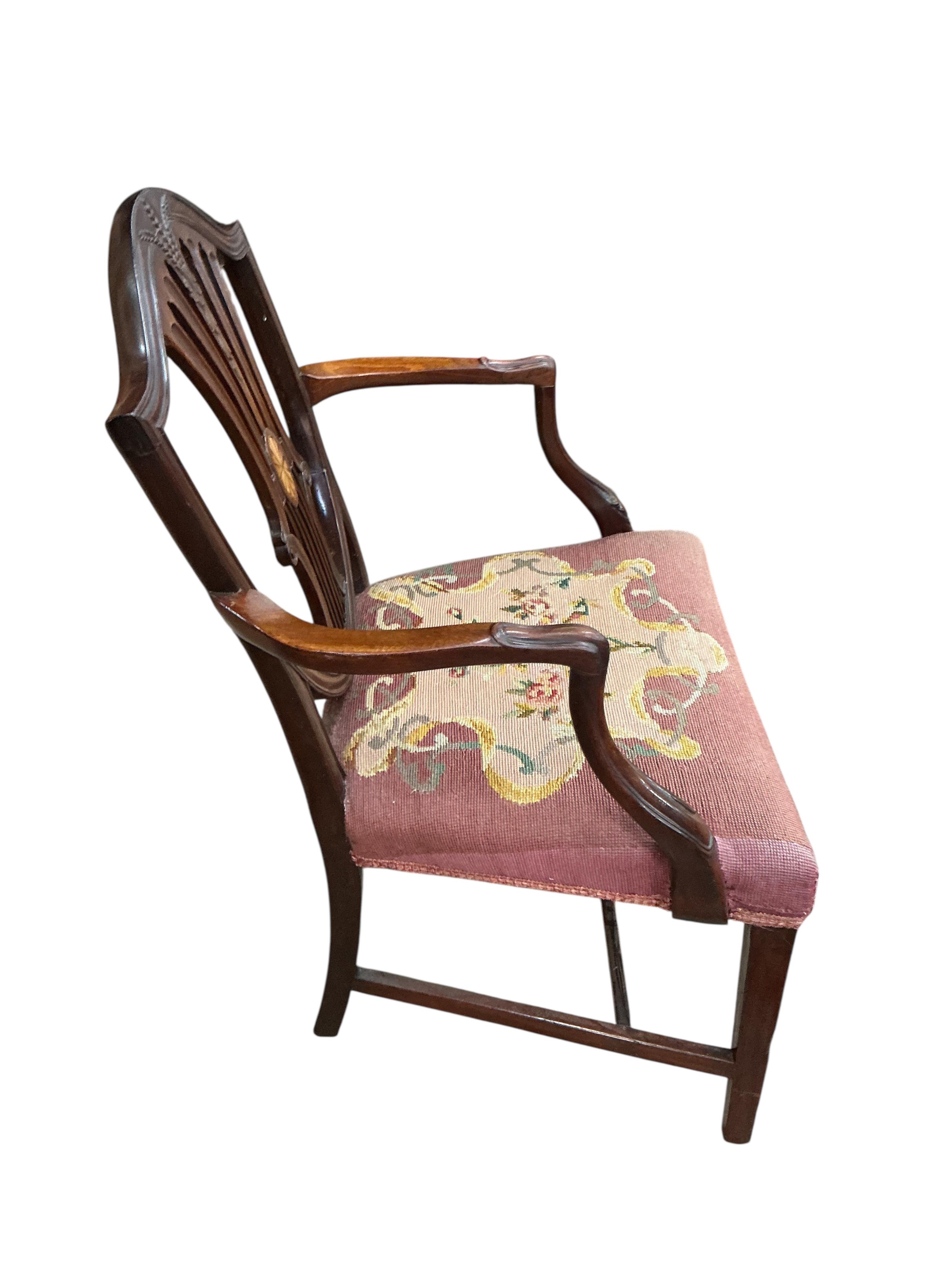 A George III mahogany dining chair and a later George III style inlaid mahogany elbow chair
